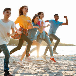 A man gardening and getting help from his granddaughter